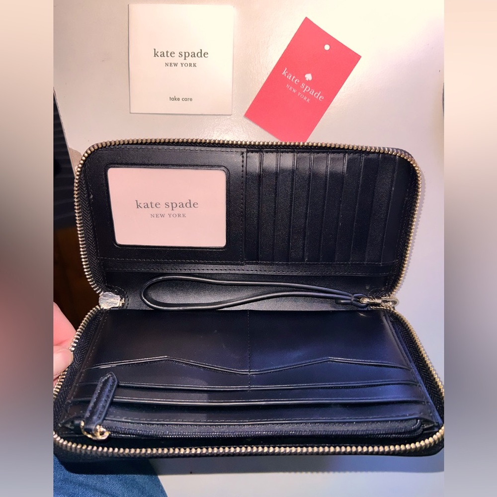 Used once authentic Katie Spade New York wrist wallet with tags.